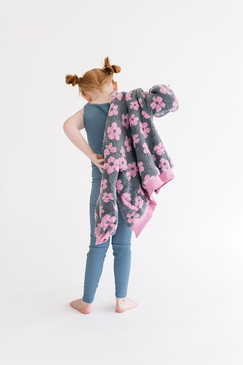 Young girl wearing Everyway kids activewear. Featuring Flower Power Jacket in Pink.