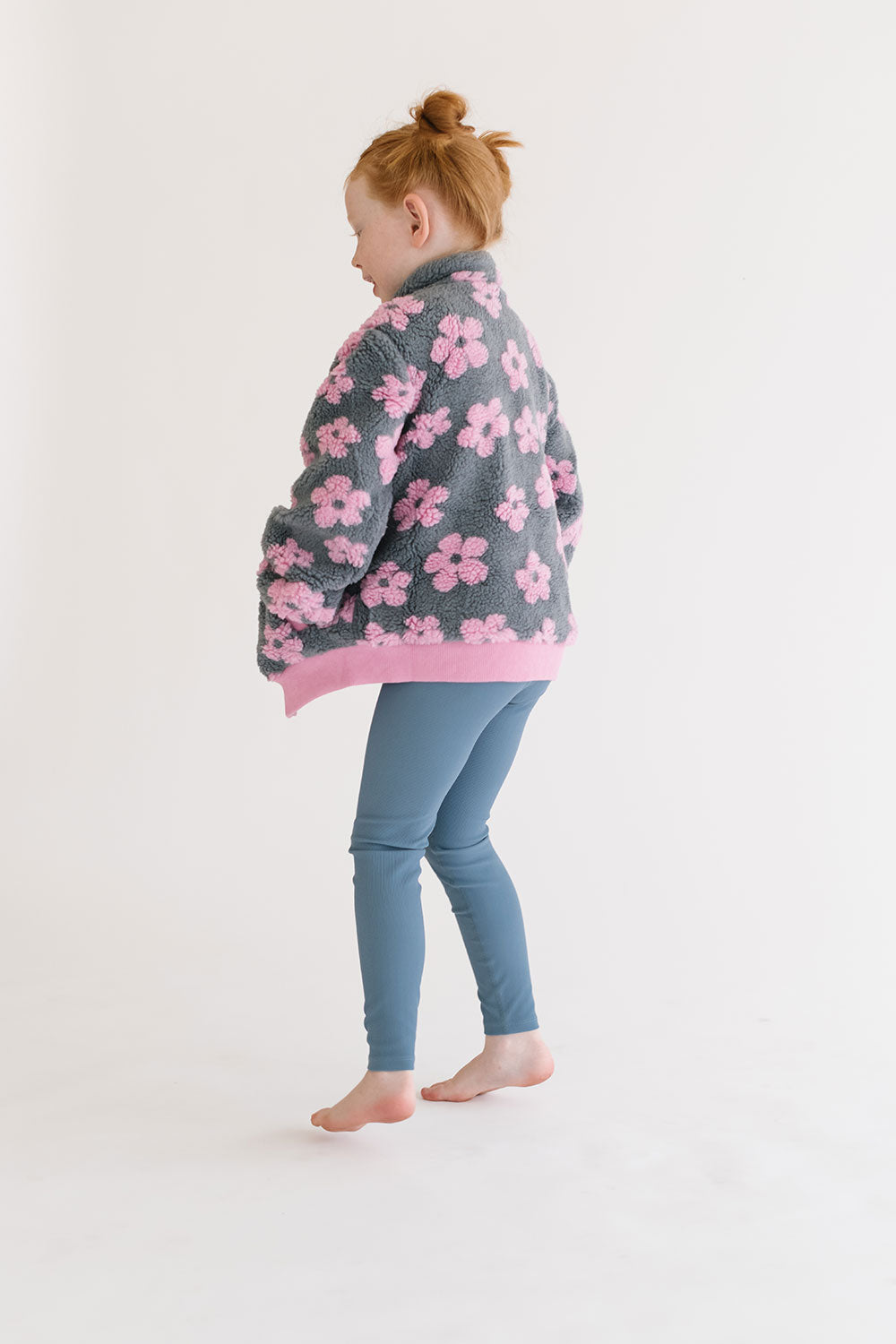 Young girl wearing Everyway kids activewear. Featuring Flower Power Jacket in Pink.