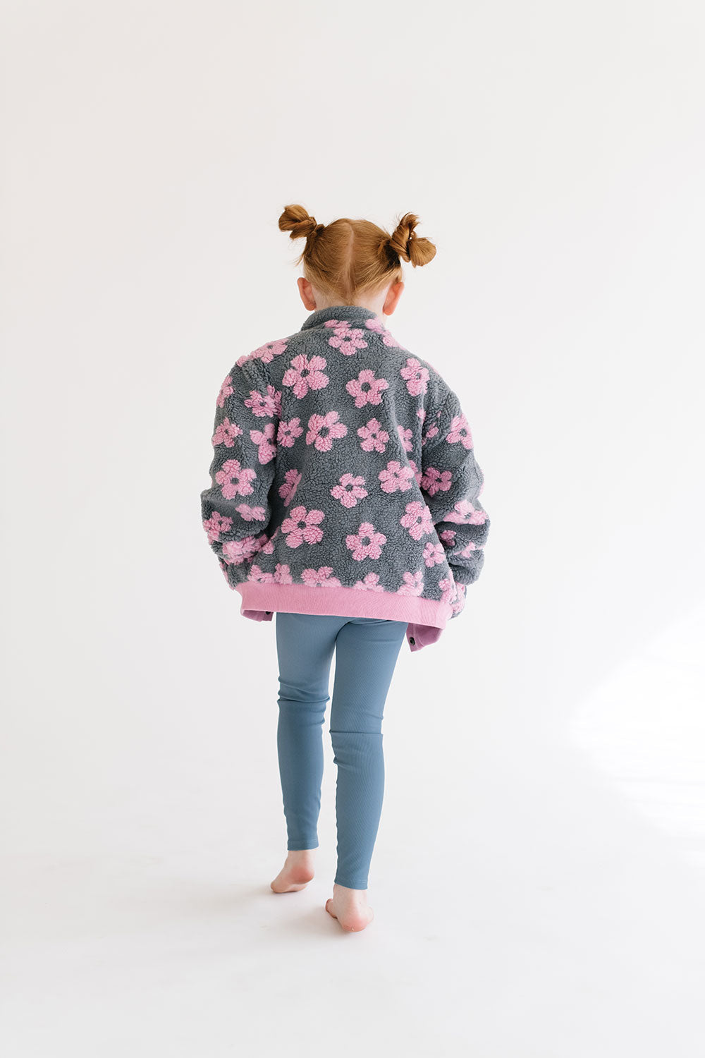 Young girl wearing Everyway kids activewear. Featuring Flower Power Jacket in Pink.