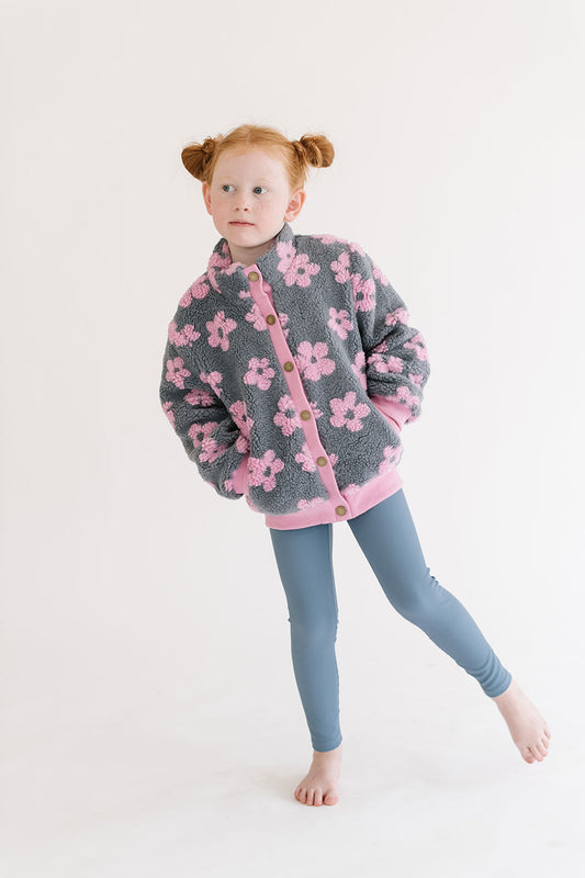 Young girl wearing Everyway kids activewear. Featuring Flower Power Jacket in Pink.