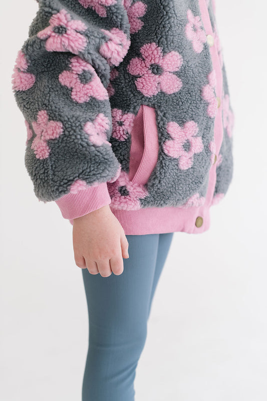 Young girl wearing Everyway kids activewear. Featuring Flower Power Jacket in Pink.