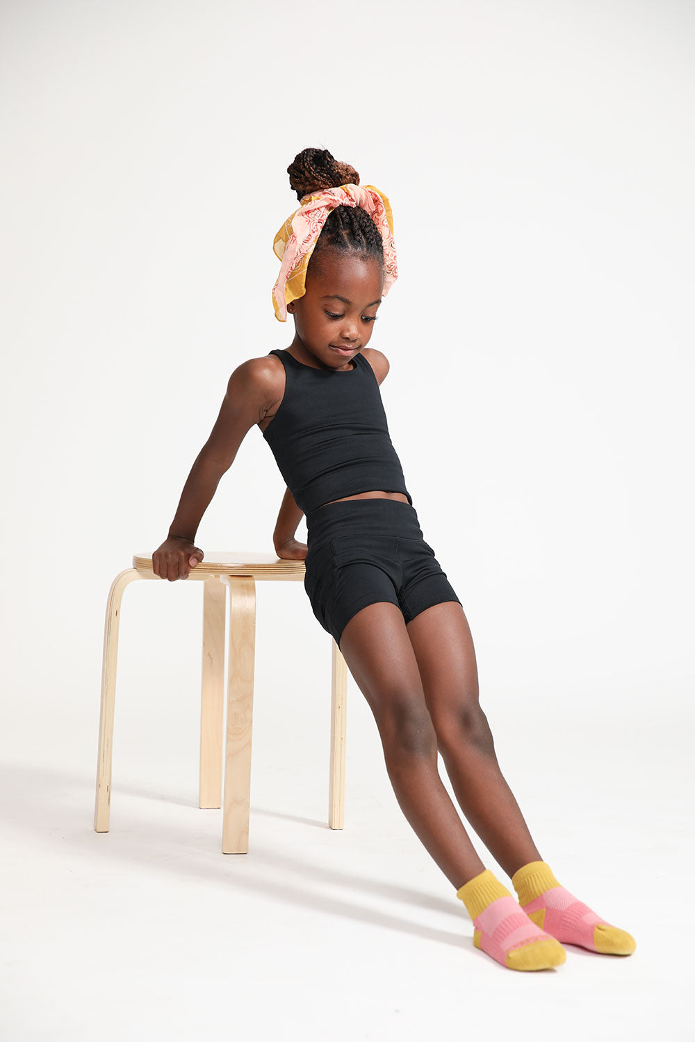 Young girl wearing Everyway kids activewear. Featuring Long Line Crop in Black.