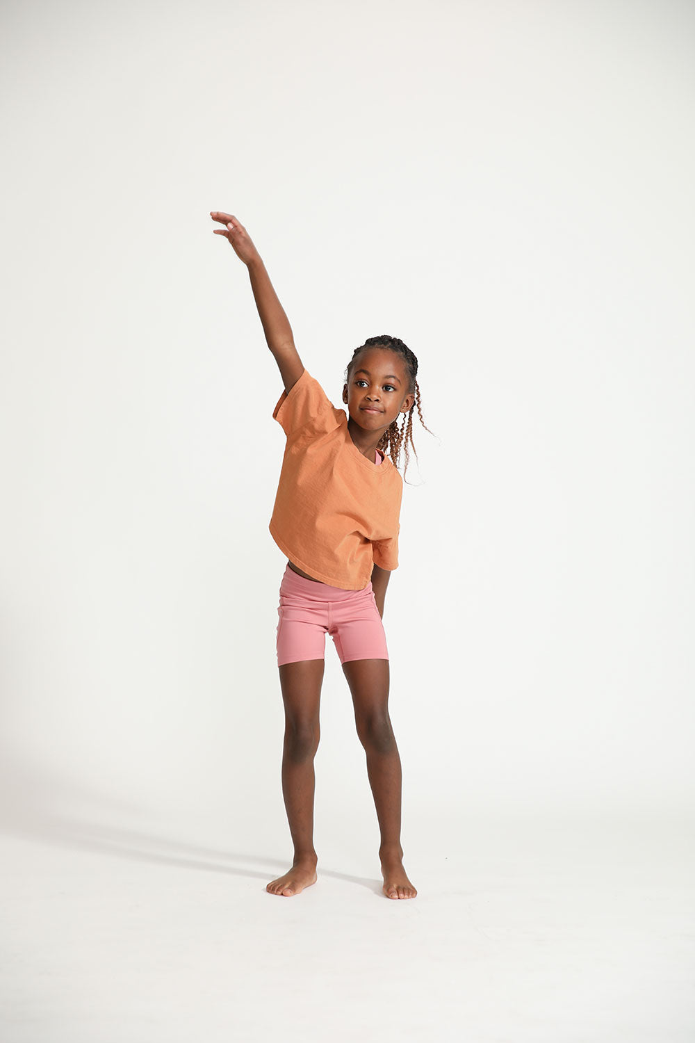 Young girl wearing Everyway kids activewear. Featuring Daily Tee in Meerkat.