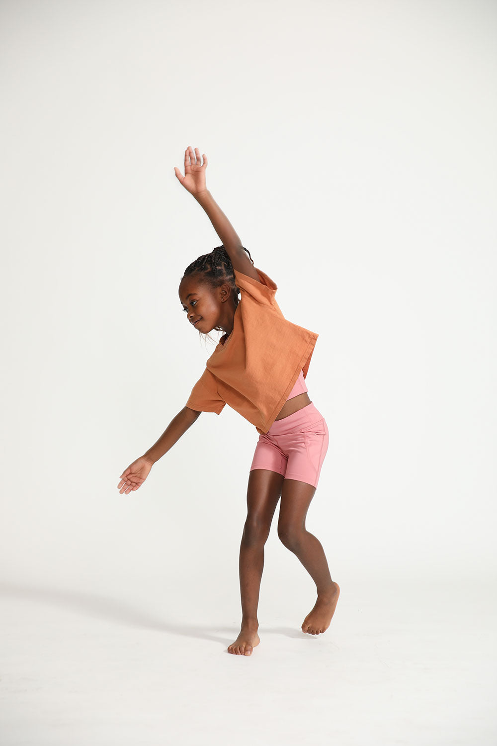 Young girl wearing Everyway kids activewear. Featuring Daily Tee in Meerkat.