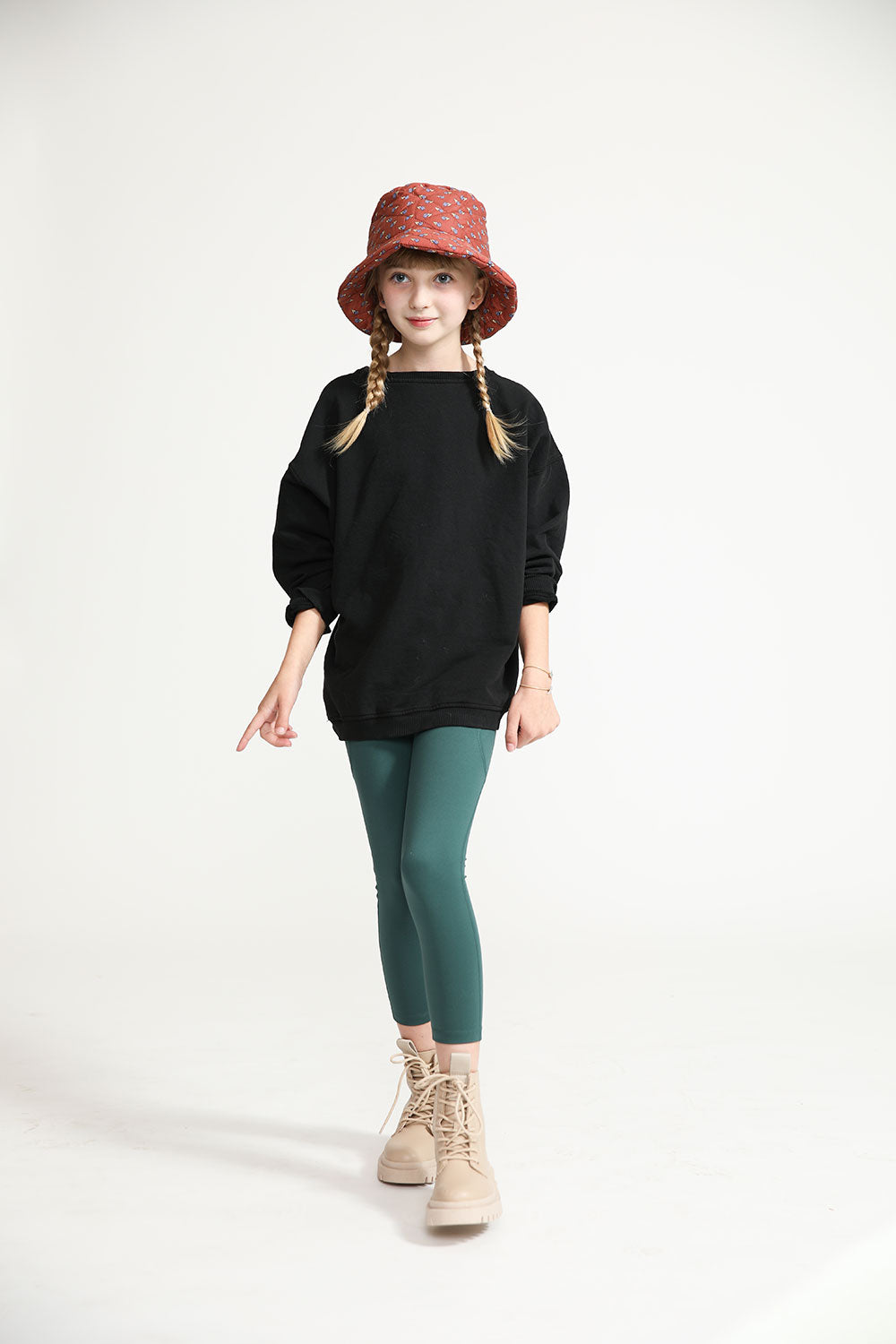 Young girl wearing Everyway kids activewear. Featuring Core Sweat Shirt in Black.