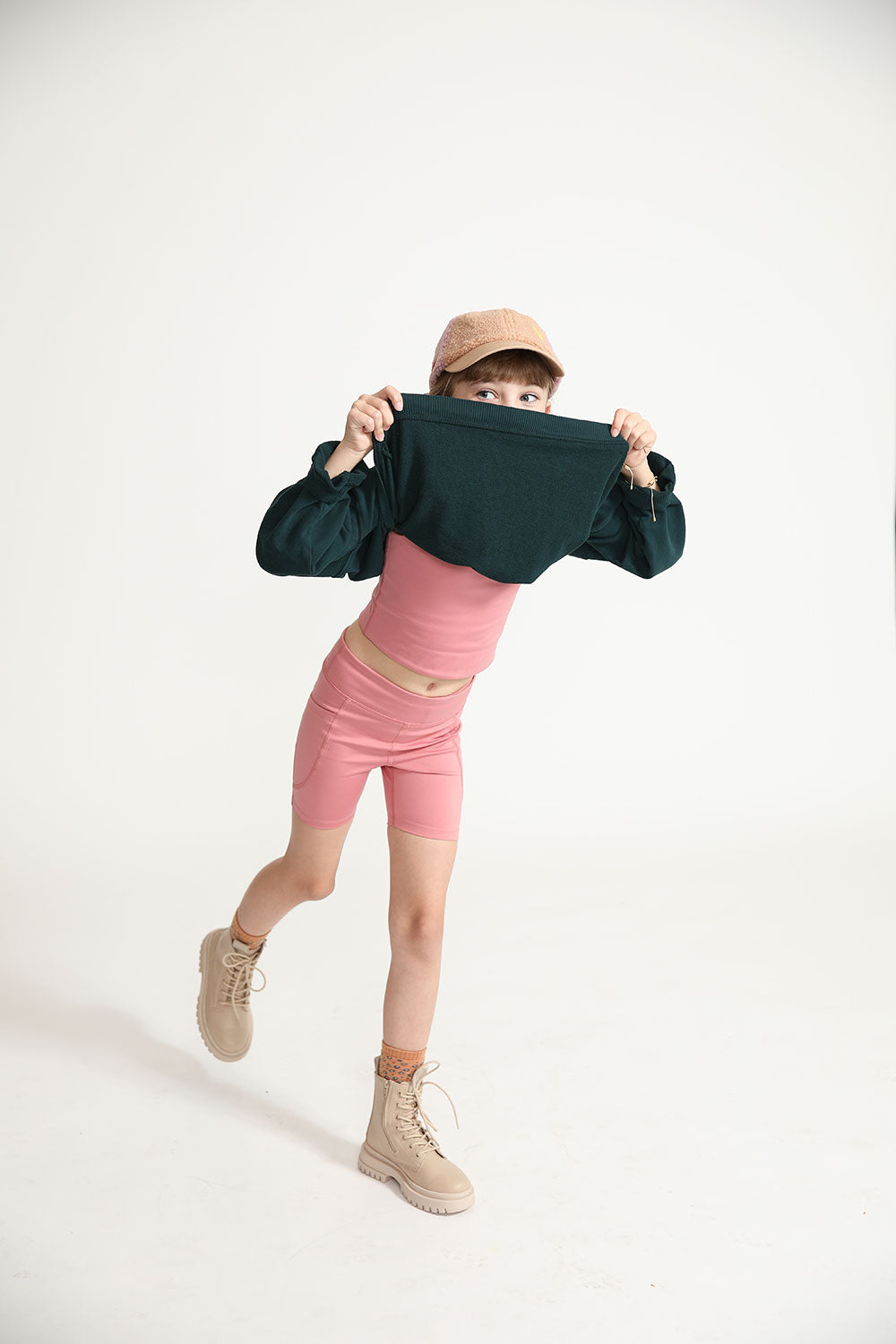 Young girl wearing Everyway kids activewear. Featuring Dusty Rose.