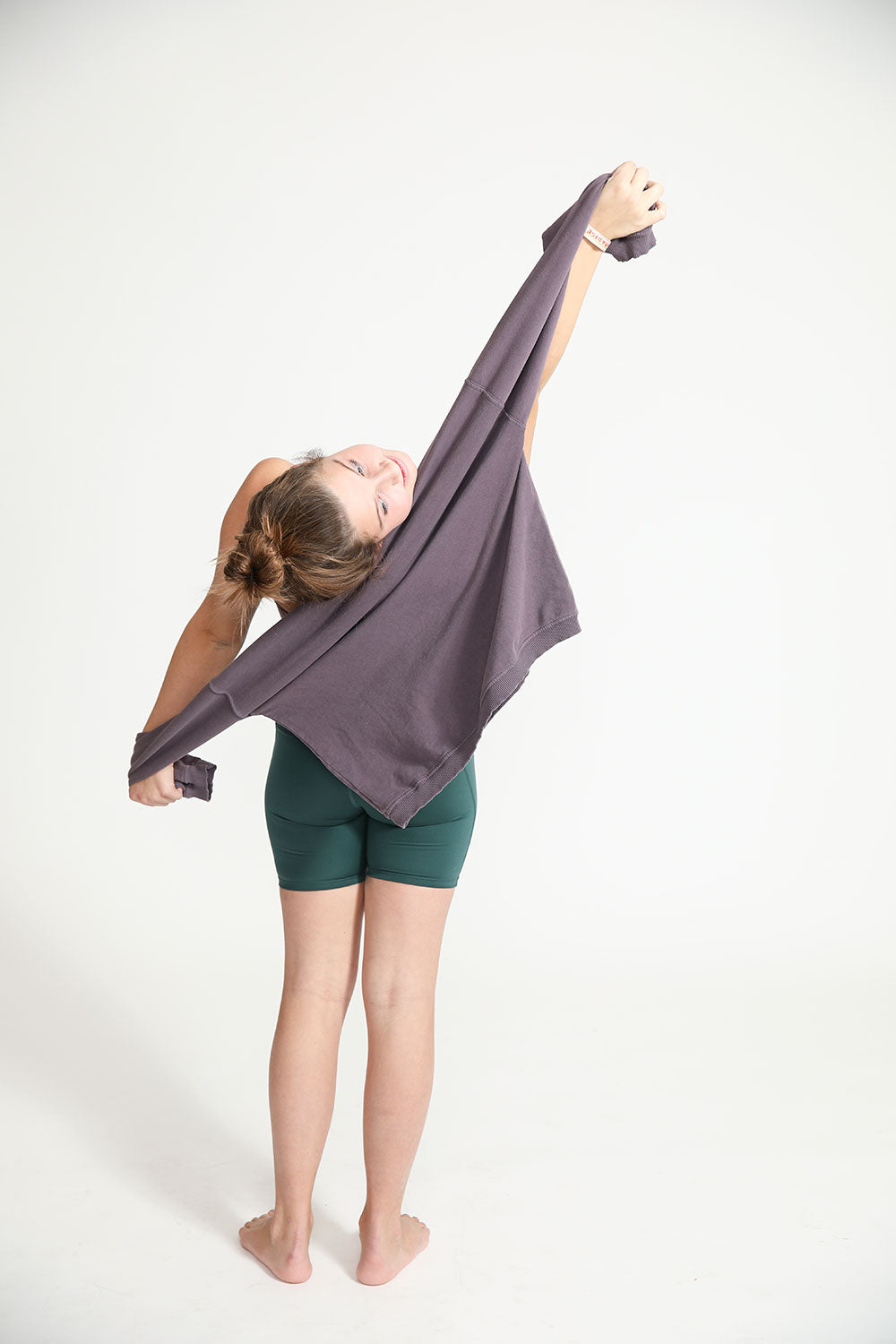 Young girl wearing Everyway kids activewear. Featuring Cycle Shorts in Pine.
