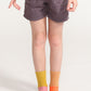 A young girl wearing crew socks from Everyway kids activewear.