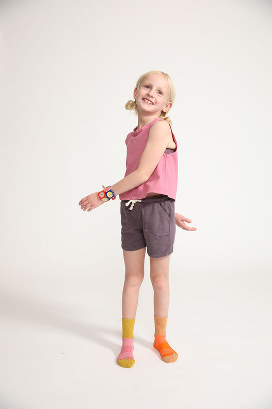 Young girl wearing Everyway kids activewear. Featuring Daily Tank Top in Dusty Rose.