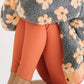 Young girl wearing Everyway kids activewear. Featuring Flower Power Jacket in Melon.