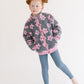 Young girl wearing Everyway kids activewear. Featuring Flower Power Jacket in Pink.