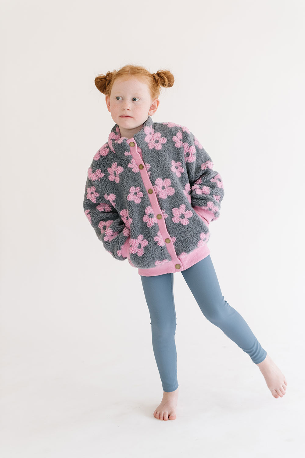 Young girl wearing Everyway kids activewear. Featuring Flower Power Jacket in Pink.