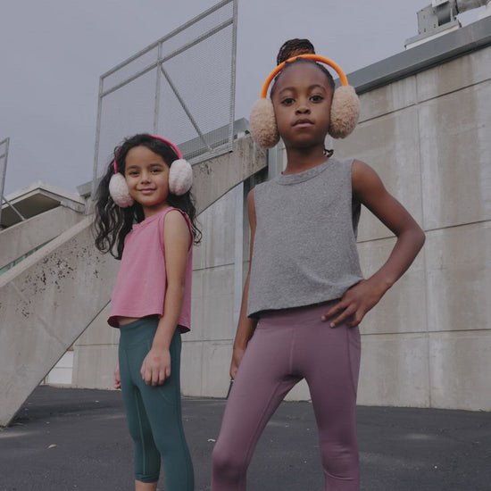 A group of young kids wearing Everyway kids activewear. Featuring All Day Leggings and Tank Tops.