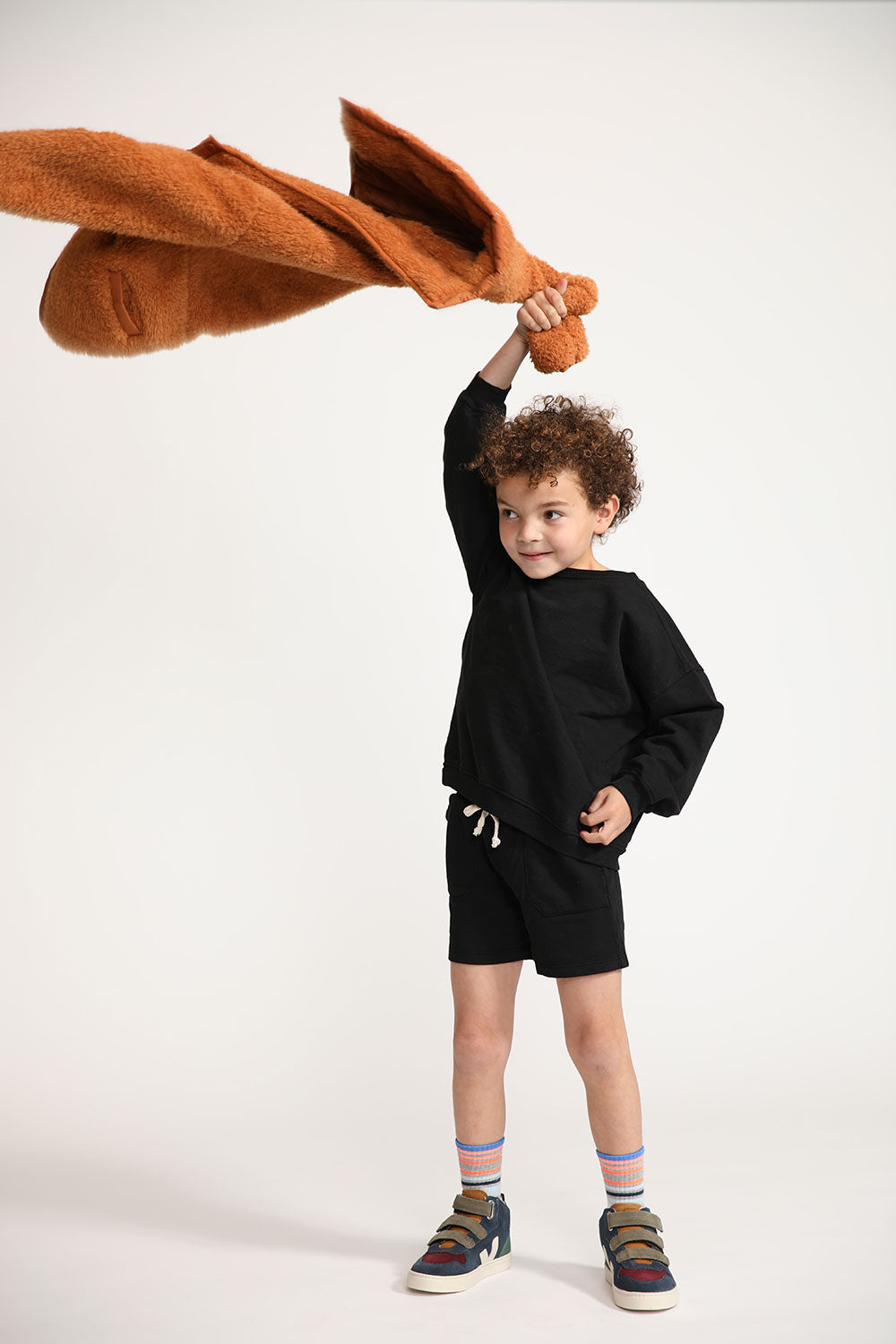 Young boy wearing Everyway kids activewear. Featuring Core Sweat Shirt in Black.
