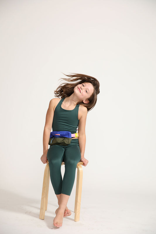 Young girl wearing Everyway kids activewear. Featuring Pine Longline Crop and All Day Leggings.