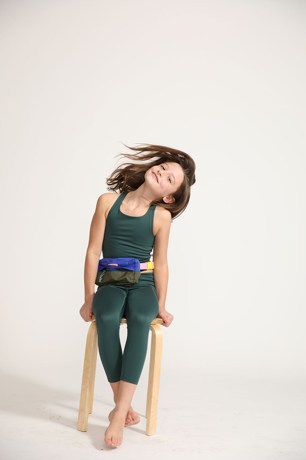 Young girl wearing Everyway kids activewear. Featuring Long Line Crop in Pine.