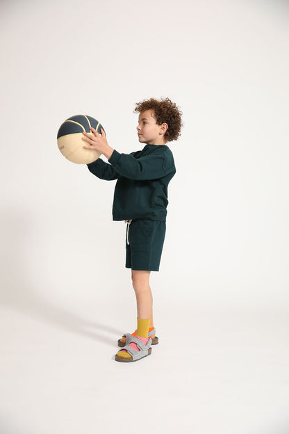 Young boy wearing Everyway kids activewear. Featuring Core Sweat Shirt in Pine.