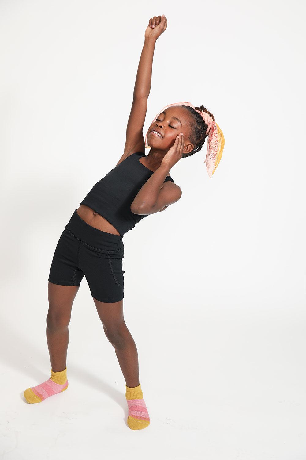 Young girl wearing Everyway kids activewear. Featuring Long Line Crop in Black.