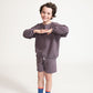 Young boy wearing Everyway kids activewear. Featuring Core Sweat Shirt in Plum