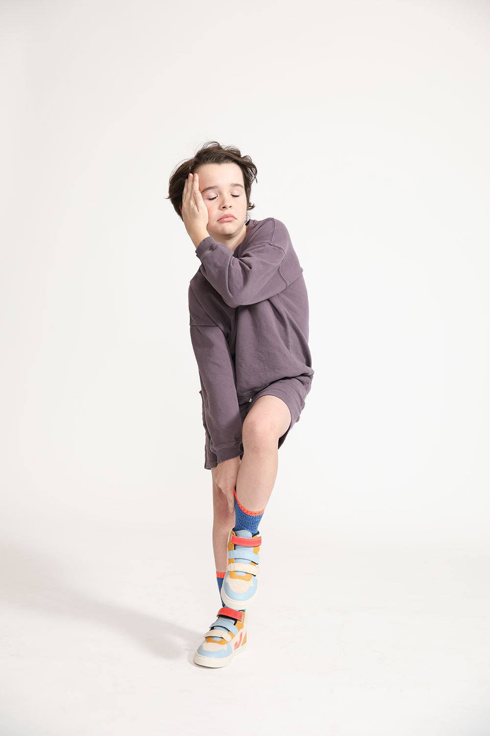 Young boy wearing Everyway kids activewear. Featuring Core Sweat Shirt in Plum