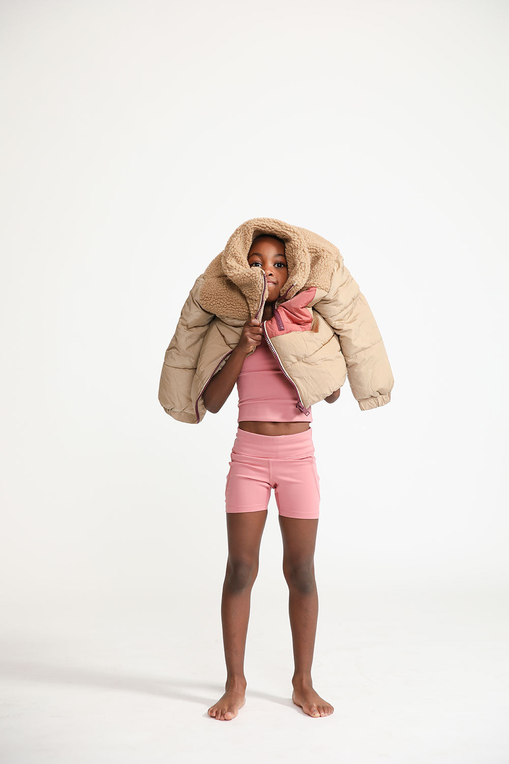 Young girl wearing Everyway kids activewear. Featuring Cycle Shorts in Dusty Rose.