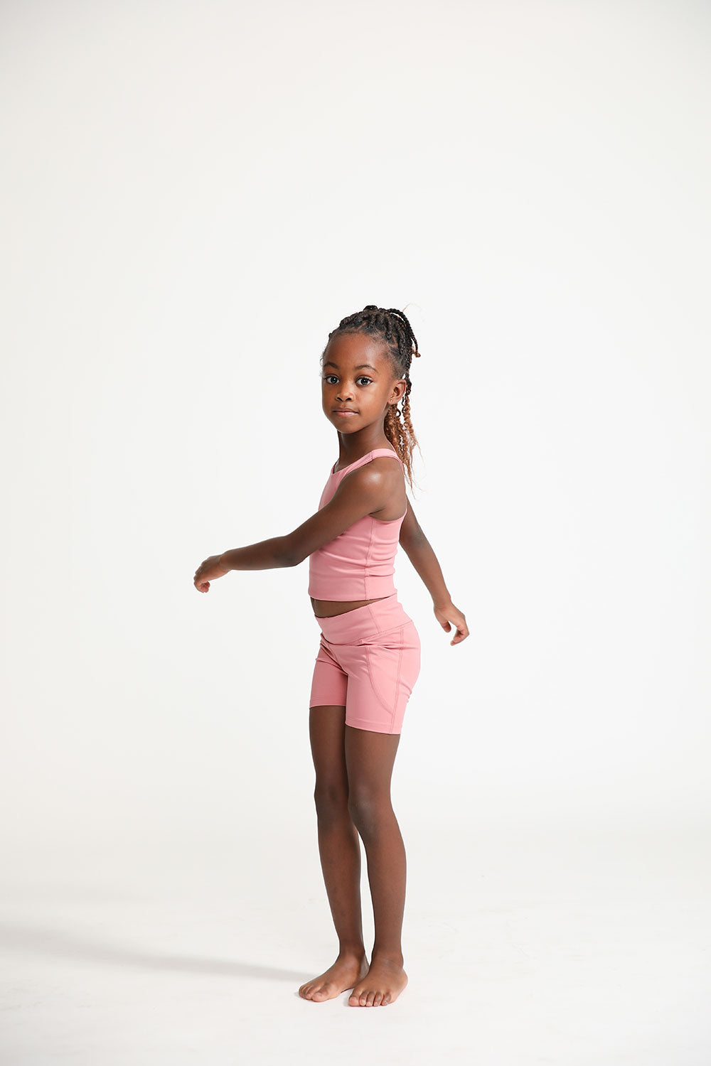 Young girl wearing Everyway kids activewear. Featuring Dusty Rose.