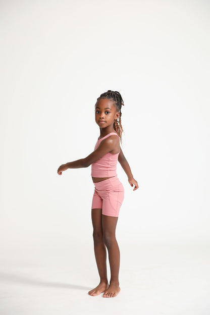 Young girl wearing Everyway kids activewear. Featuring Dusty Rose.