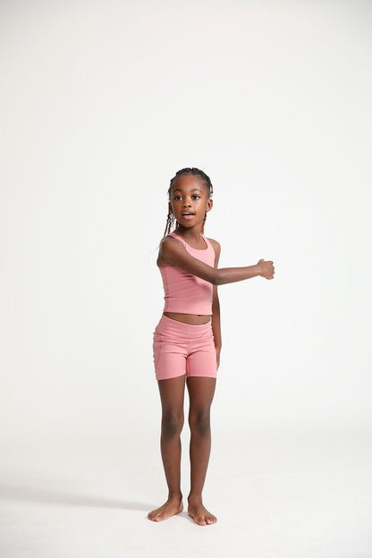 Young girl wearing Everyway kids activewear. Featuring Dusty Rose.