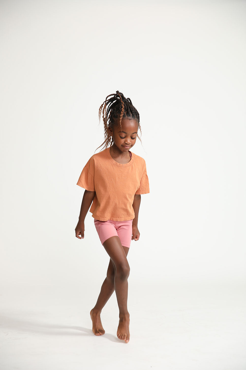 Young girl wearing Everyway kids activewear. Featuring Daily Tee in Meerkat.