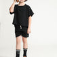Young boy wearing Everyway kids activewear. Featuring Daily Tee in Black.