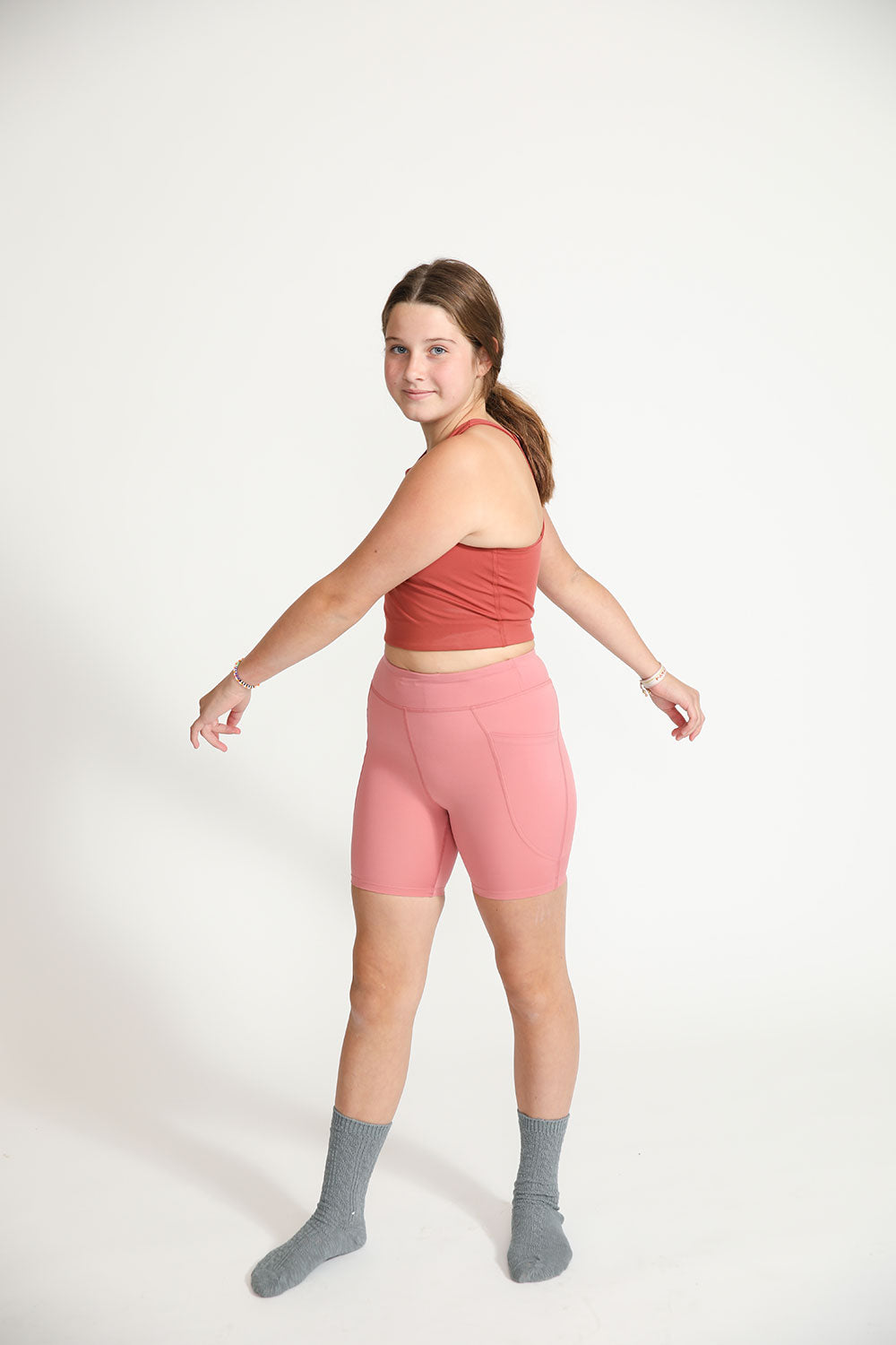 Young girl wearing Everyway kids activewear. Featuring Cycle Shorts in Dusty Rose.