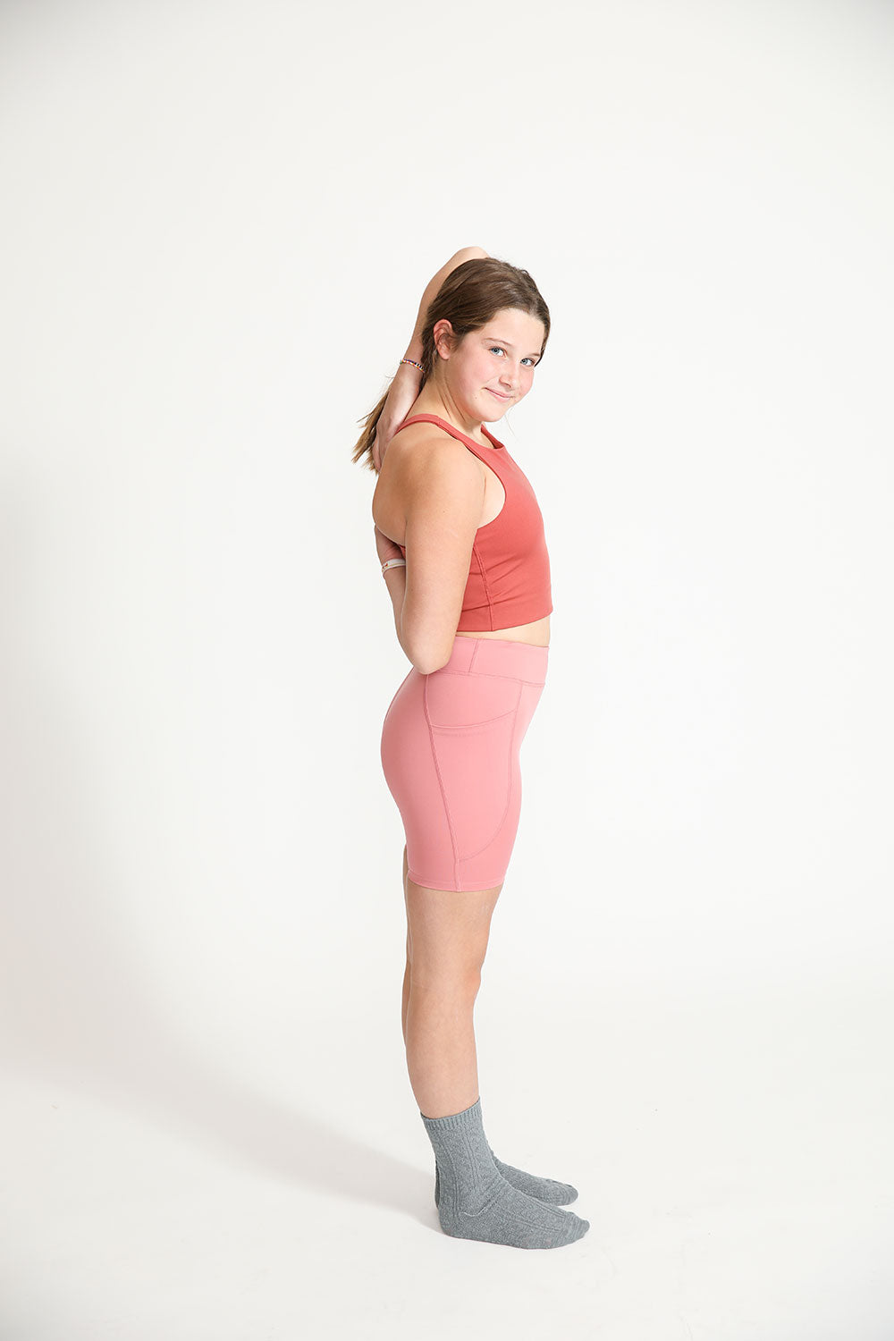 Young girl wearing Everyway kids activewear. Featuring Cycle Shorts in Dusty Rose.