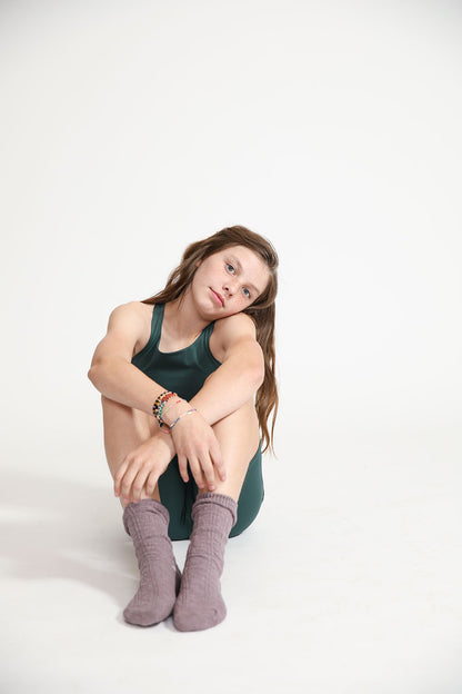 Young girl wearing Everyway kids activewear. Featuring Long Line Crop in Pine.