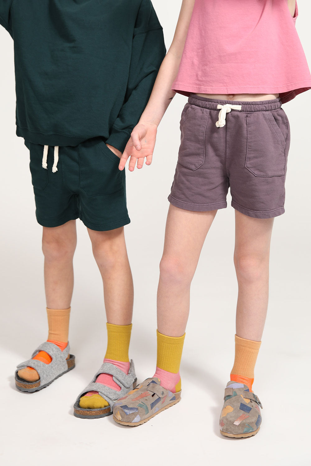 A young boy and girl wearing crew socks from Everyway kids activewear.