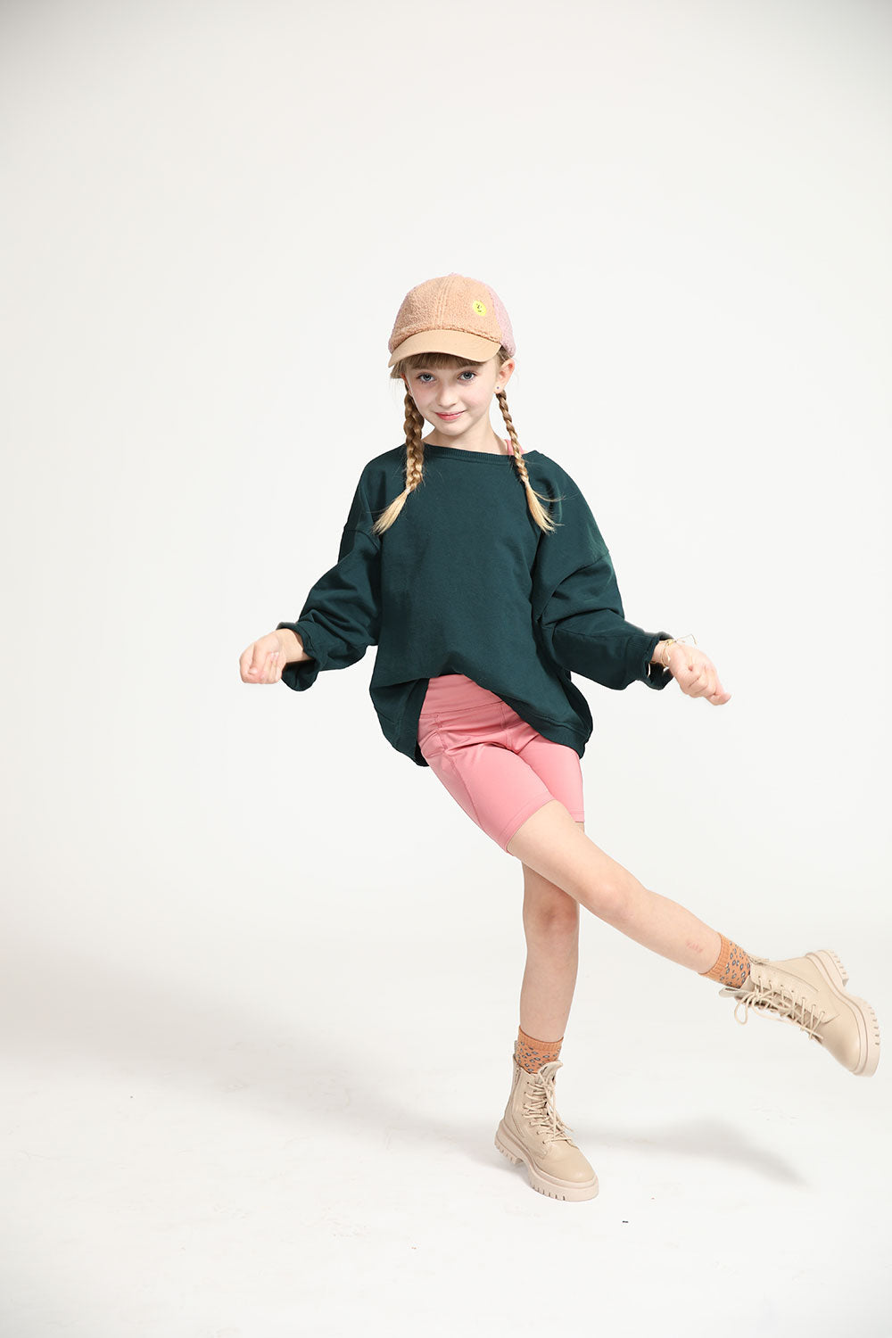 Young girl wearing Everyway kids activewear. Featuring Cycle Shorts in Dusty Rose.