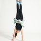 Young girl doing a headstand wearing Everyway kids activewear. Featuring black Longline Crop and All Day Leggings.