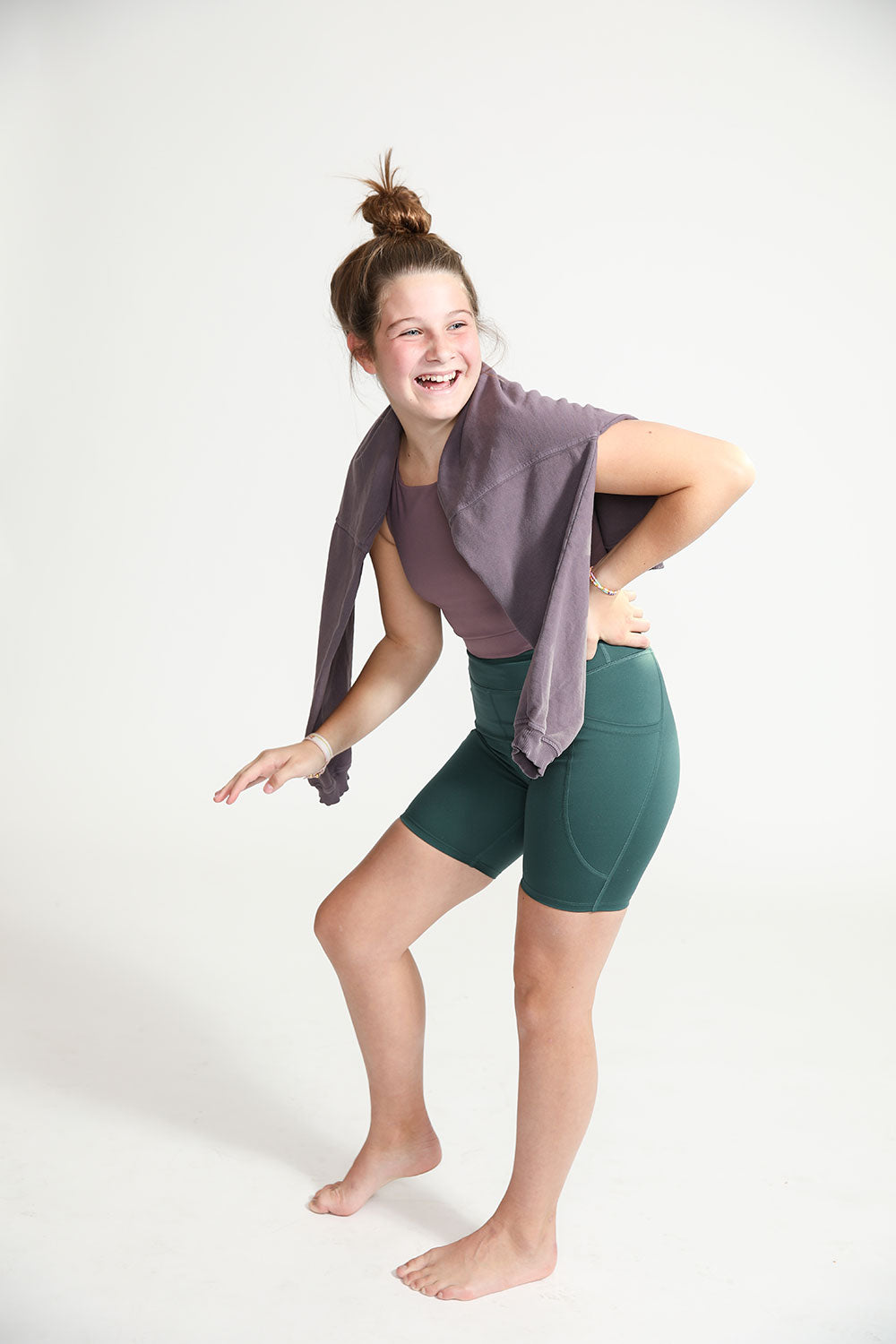 Young girl wearing Everyway kids activewear. Featuring Cycle Shorts in Pine.