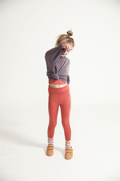 Young girl wearing Everyway kids activewear. Featuring Spice Longline Crop and All Day Leggings.