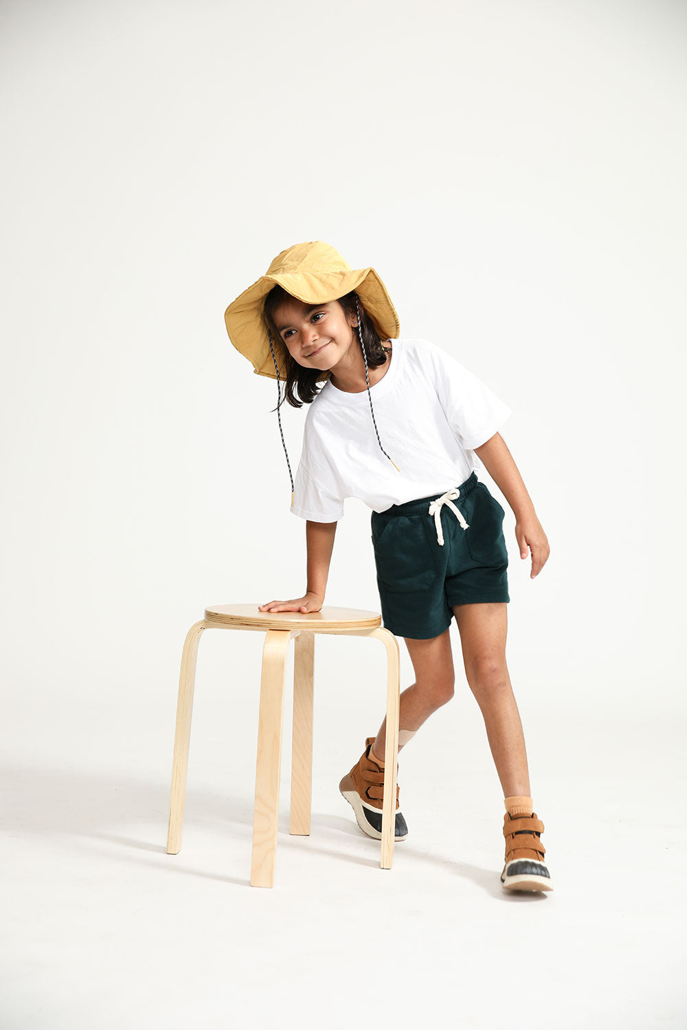 Young girl wearing Everyway kids activewear. Featuring Daily Tee in White.