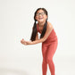Young girl wearing Everyway kids activewear. Featuring Spice Longline Crop and All Day Leggings.