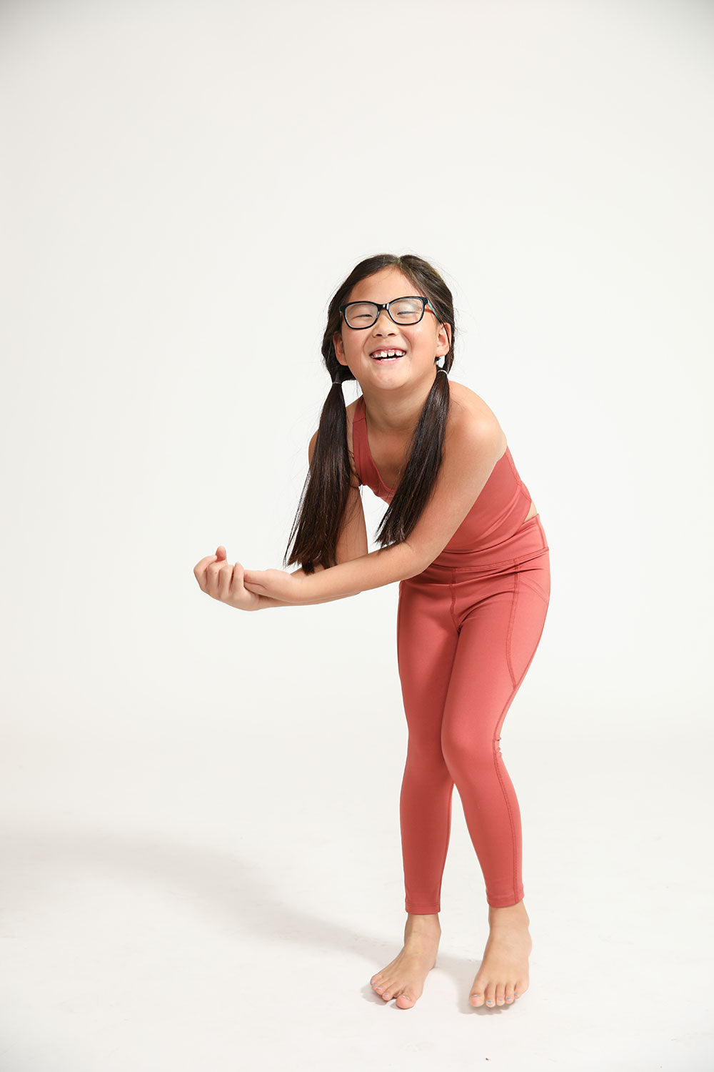 Young girl wearing Everyway kids activewear. Featuring Spice Longline Crop and All Day Leggings.
