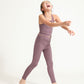 Young girl wearing Everyway kids activewear. Featuring Plum Longline Crop and All Day Leggings.