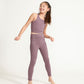 Young girl wearing Everyway kids activewear. Featuring Long Line Crop in Plum.