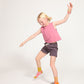 Young girl wearing Everyway kids activewear. Featuring Daily Tank Top in Dusty Rose.