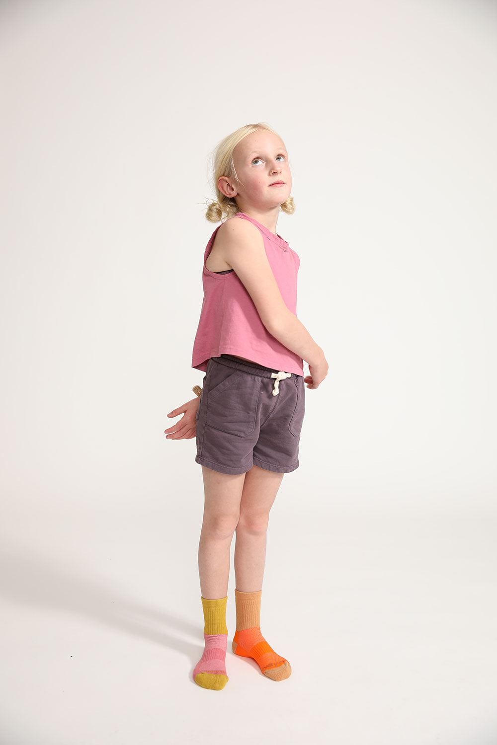 Young girl wearing Everyway kids activewear. Featuring Daily Tank Top in Dusty Rose.