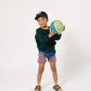 Young boy playing with a basketball in Everyway activewear. Featuring fanny pack in blue
