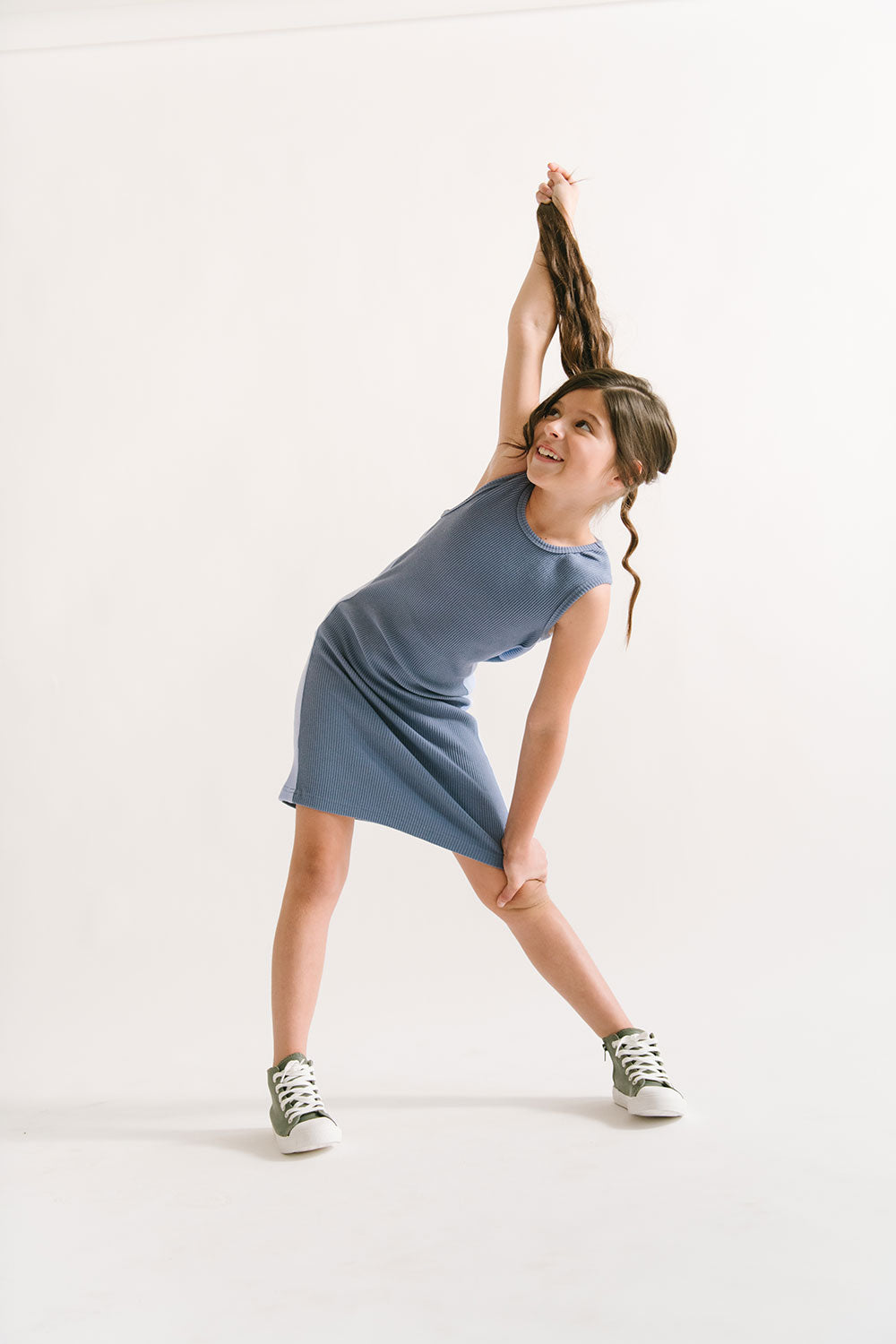 Young girl wearing Everyway kids activewear. Featuring Go Dress in Dusk.