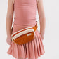 Young girl wearing Everyway kids activewear. Featuring Pleated Court Skort in Rose.