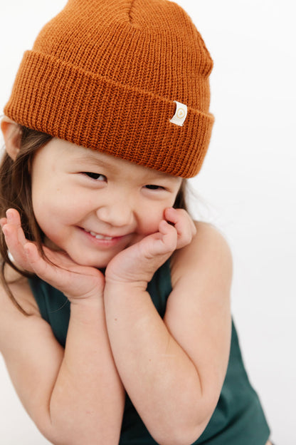 Young girl wearing Everyway kids activewear. Featuring Waffle Knit Beanie in Coffee.