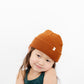 Young girl wearing Everyway kids activewear. Featuring Waffle Knit Beanie in Coffee.